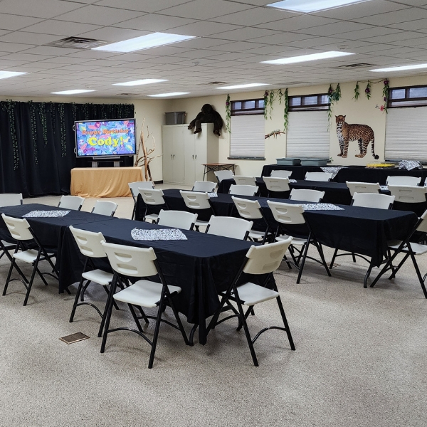 Tables and chairs set up with decorative coverings