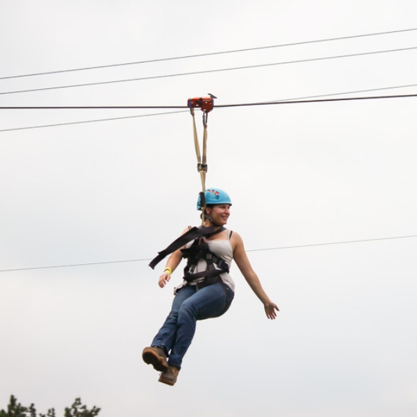 Woman glides on zipline