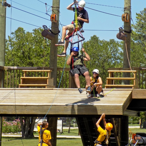 Zipliner being lowered from platform
